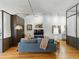 Modern living room with hardwood floors, stylish furniture, and exposed concrete ceilings at 1499 Blake St # 3U, Denver, CO 80202