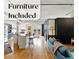 Open-concept living area with hardwood floors and stainless steel appliances at 1499 Blake St # 3U, Denver, CO 80202