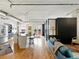 Open concept living space with modern finishes, stainless steel appliances, hardwood floors, and an abundance of natural light at 1499 Blake St # 3U, Denver, CO 80202