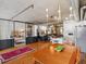Open concept living and dining area with hardwood floors, exposed ductwork, and a view of the bedroom and kitchen at 1499 Blake St # 3U, Denver, CO 80202