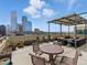 Spacious rooftop deck with outdoor seating, offering stunning city skyline views at 1499 Blake St # 3U, Denver, CO 80202