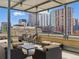 Relaxing rooftop deck with comfortable seating and panoramic city views at 1499 Blake St # 3U, Denver, CO 80202