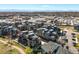 Aerial view showcasing modern townhome community with a green spaces and views of the surrounding area at 5004 S Platte River Pkwy, Littleton, CO 80123