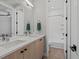 Bathroom features a double sink vanity, tile floors, and a separate shower and bathtub at 5004 S Platte River Pkwy, Littleton, CO 80123