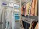 Walk-in closet featuring built in storage, hanging rods, and ample storage space at 5004 S Platte River Pkwy, Littleton, CO 80123