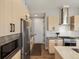 Modern kitchen featuring stainless steel appliances, sleek cabinetry, and a functional design for cooking at 5004 S Platte River Pkwy, Littleton, CO 80123