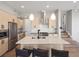 Stylish kitchen featuring an island with bar seating, modern appliances, and sleek cabinetry at 5004 S Platte River Pkwy, Littleton, CO 80123