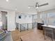 Open-concept living area with hardwood floors, modern fixtures, and abundant natural light at 5004 S Platte River Pkwy, Littleton, CO 80123