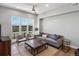 Bright living room featuring large windows, modern furnishings, and a comfortable seating arrangement at 5004 S Platte River Pkwy, Littleton, CO 80123