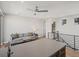 Bright living space with hardwood floors, modern ceiling fan, and comfortable seating at 5004 S Platte River Pkwy, Littleton, CO 80123