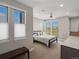 Main bedroom featuring large windows for natural light and modern finishes throughout at 5004 S Platte River Pkwy, Littleton, CO 80123
