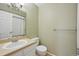 Cozy bathroom with a vanity and mirror, toilet, and a shower curtain at 12655 E Pacific Cir # C, Aurora, CO 80014