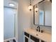 Bathroom featuring pendant lights, and a modern sink and faucet at 384 S Ironton St # 208, Aurora, CO 80012