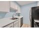 Efficient kitchen with white cabinets, stainless steel appliances, and sleek countertops provides a functional space at 384 S Ironton St # 208, Aurora, CO 80012