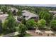Aerial view of a home surrounded by mature trees and landscaped gardens in a quiet neighborhood at 7119 S Riviera St, Aurora, CO 80016