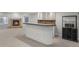 Finished basement wet bar with granite counters, custom cabinets, and nearby fireplace for entertaining at 7119 S Riviera St, Aurora, CO 80016