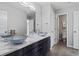 Stylish bathroom featuring a double vanity with decorative vessel sinks and modern fixtures at 7119 S Riviera St, Aurora, CO 80016