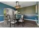 Charming dining room featuring a glass table and decorative wallpaper at 7119 S Riviera St, Aurora, CO 80016