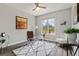 Bright home office with a modern desk, comfortable seating, and view of the backyard at 7119 S Riviera St, Aurora, CO 80016