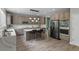 Bright kitchen featuring modern appliances, a marble island and quartz countertops at 7119 S Riviera St, Aurora, CO 80016