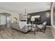 Comfortable living room featuring a fireplace, modern lighting, and views of the home's exterior at 7119 S Riviera St, Aurora, CO 80016