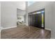 Open-concept living area with hardwood floors and vaulted ceilings at 7119 S Riviera St, Aurora, CO 80016