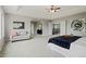 Expansive main bedroom featuring a sitting area, tray ceiling, and ensuite bathroom at 7119 S Riviera St, Aurora, CO 80016
