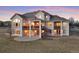 Elegant home featuring a spacious backyard with a multi-level deck and walk out basement at 16394 W 77Th Ln, Arvada, CO 80007