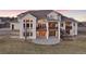 Stately home with a walk-out basement and large deck offering outdoor living at 16394 W 77Th Ln, Arvada, CO 80007