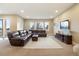 Finished basement recreation area with a large sectional sofa at 16394 W 77Th Ln, Arvada, CO 80007