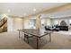 Finished basement game room, featuring a ping pong table at 16394 W 77Th Ln, Arvada, CO 80007