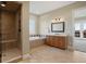 Bathroom boasts a large shower, soaking tub, and double vanity at 16394 W 77Th Ln, Arvada, CO 80007