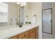 Clean bathroom, featuring a large vanity and shower at 16394 W 77Th Ln, Arvada, CO 80007