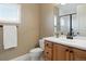 Light and bright bathroom with a modern vanity and toilet at 16394 W 77Th Ln, Arvada, CO 80007