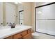 Clean bathroom with a tub/shower combo and updated vanity at 16394 W 77Th Ln, Arvada, CO 80007