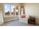 Bright bedroom with a large window offering a view of the surrounding area at 16394 W 77Th Ln, Arvada, CO 80007