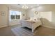 Bright bedroom with a comfortable bed and window views at 16394 W 77Th Ln, Arvada, CO 80007