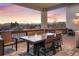 Deck with mountain views and seating area for outdoor dining at 16394 W 77Th Ln, Arvada, CO 80007
