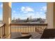Deck overlooking scenic landscape with distant mountains at 16394 W 77Th Ln, Arvada, CO 80007
