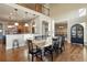 Open concept dining area adjacent to kitchen with hardwood floors at 16394 W 77Th Ln, Arvada, CO 80007