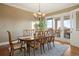 Elegant dining room with hardwood floors and access to patio at 16394 W 77Th Ln, Arvada, CO 80007
