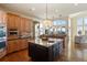 Spacious kitchen with island, double oven, and ample counter space at 16394 W 77Th Ln, Arvada, CO 80007