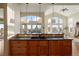 Kitchen with island and breakfast bar, offering scenic views at 16394 W 77Th Ln, Arvada, CO 80007
