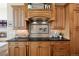 Gourmet kitchen featuring granite countertops and a gas cooktop at 16394 W 77Th Ln, Arvada, CO 80007