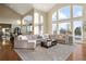 Open living space with large sectional sofa and high ceilings at 16394 W 77Th Ln, Arvada, CO 80007