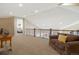 Spacious loft area with a comfortable sitting area at 16394 W 77Th Ln, Arvada, CO 80007