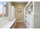 Bright mudroom boasts built-in bench seating and storage at 16394 W 77Th Ln, Arvada, CO 80007