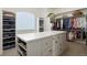 Large walk-in closet with ample shelving and drawers at 16394 W 77Th Ln, Arvada, CO 80007