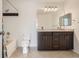 Bathroom featuring a double vanity with granite countertops and a shower-tub combo at 6506 Silver Mesa Dr # F, Highlands Ranch, CO 80130