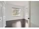Bright bedroom with hardwood floors and large windows offering ample natural light at 6506 Silver Mesa Dr # F, Highlands Ranch, CO 80130